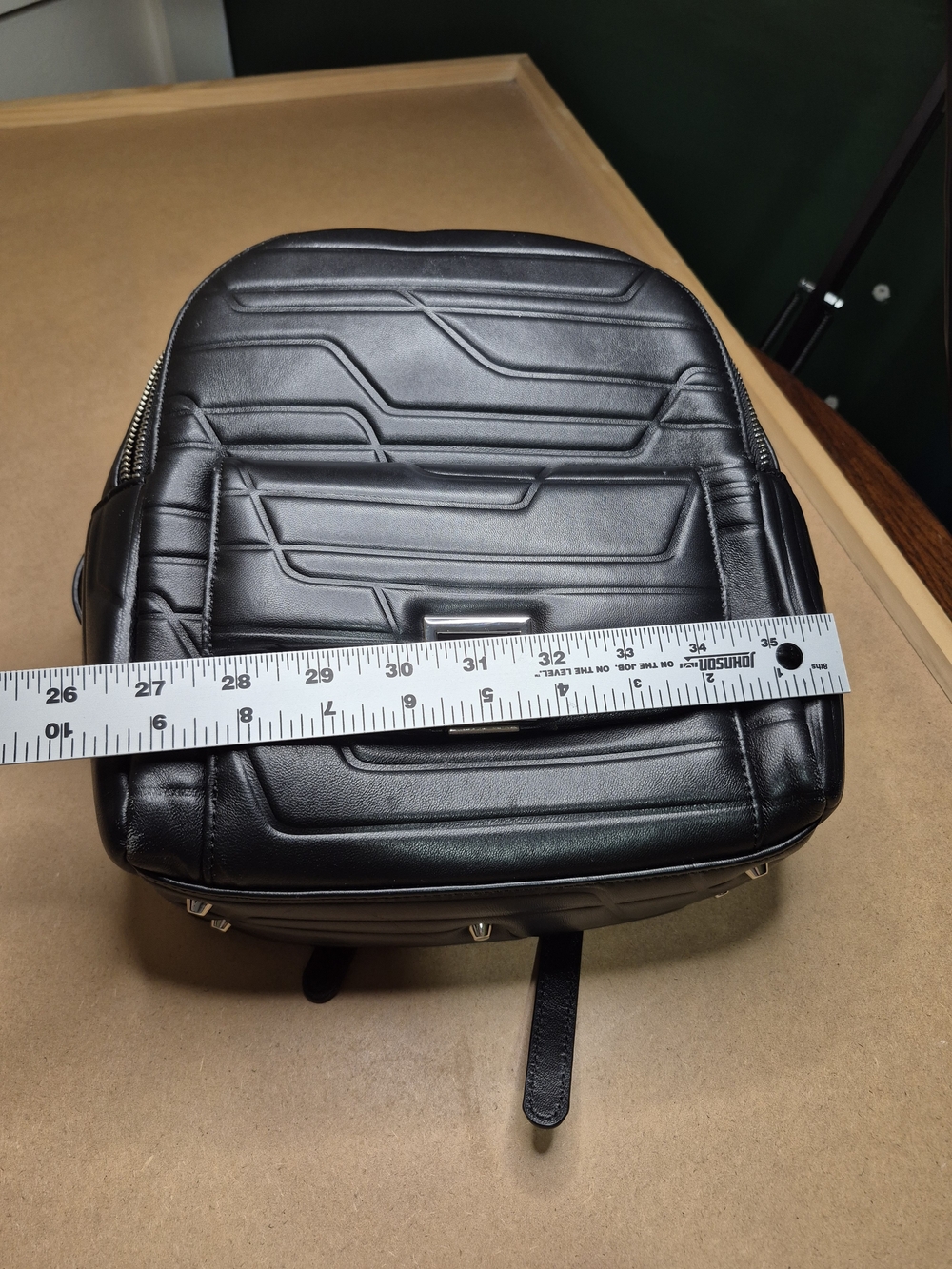 Black Quilted Leather Backpack with Polished Metal Clasp - Picture 2 of 11